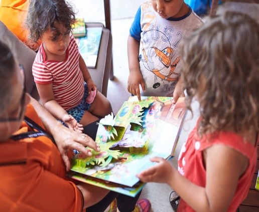 Midland children reading a book